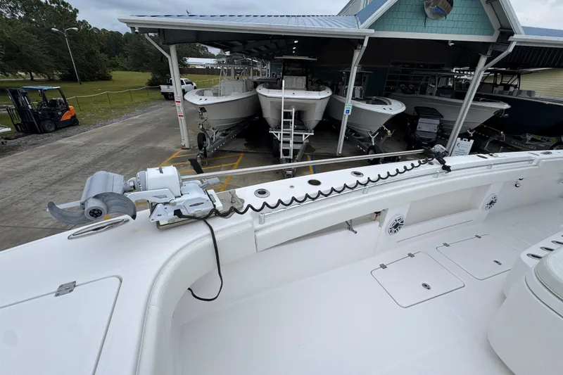 Slide: The Image of 2025 Invincible 40 Catamaran at marina, showcasing deck and equipment. - 23