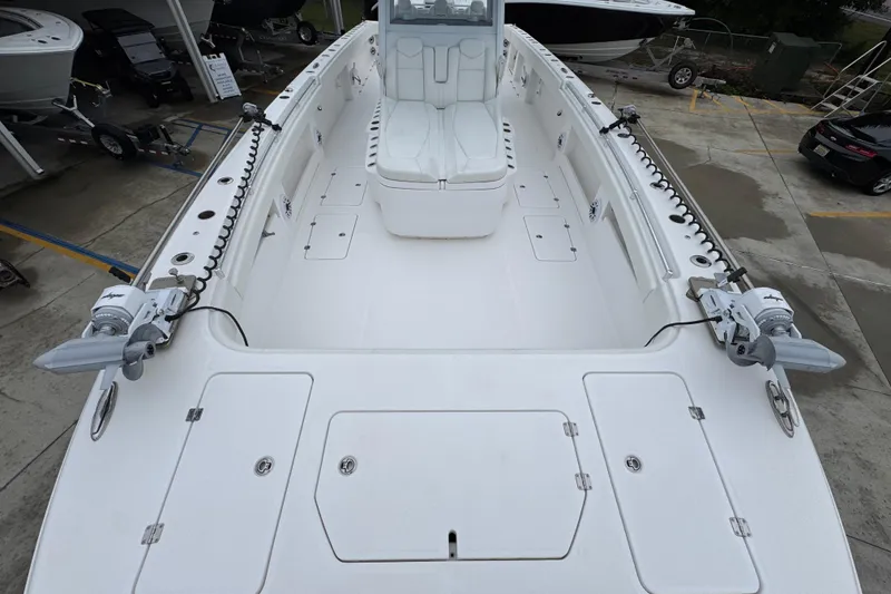 Slide: The Image of 2025 Invincible 40 Catamaran boat deck, spacious seating, and modern design. - 25