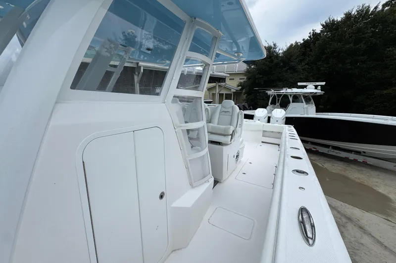 Slide: The Image of 2025 Invincible 40 Catamaran with sleek white deck and modern design. - 29