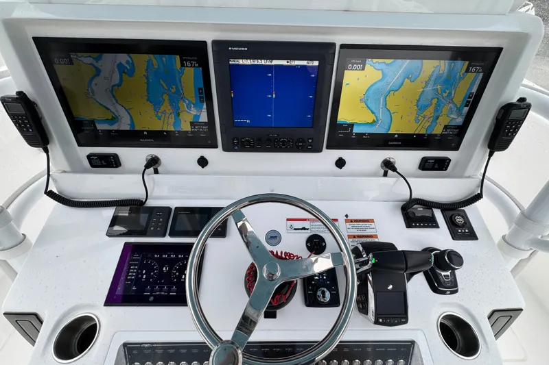 Slide: The Image of 2025 Invincible 40 Catamaran helm with advanced navigation displays and controls. - 39