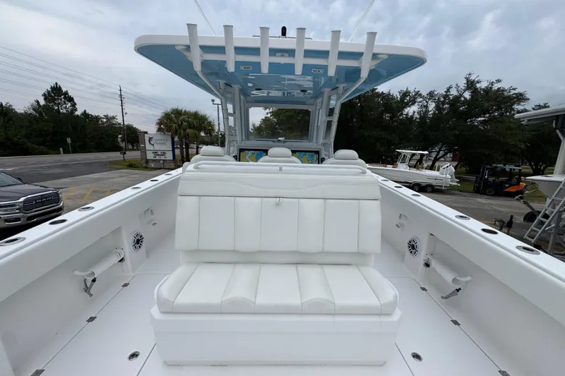 Slide: The Image of 2025 Invincible 40 Catamaran with white seating and spacious deck. - 44