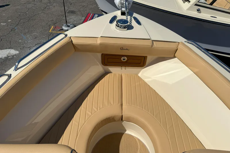 Slide: The Image of 2026 Rossiter 23 Open Bow boat with tan seating and sleek design. - 7