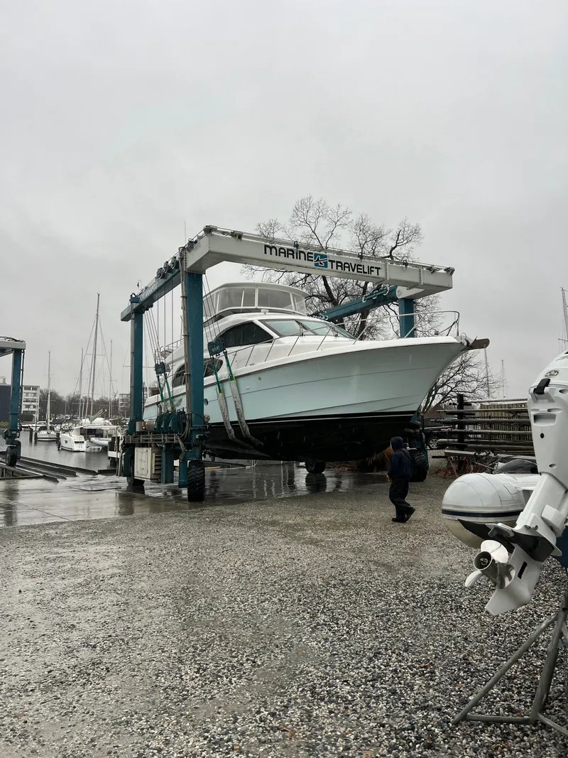 Slide: The Image of 2008 Hatteras 64 Motor Yacht on a boat lift at the marina. - 27