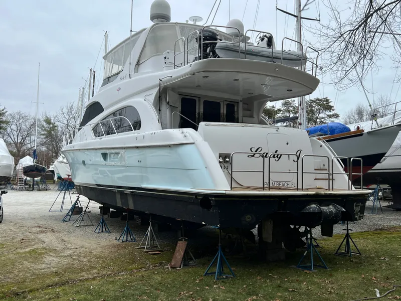 Slide: The Image of 2008 Hatteras 64 Motor Yacht on stands outdoors. - 33