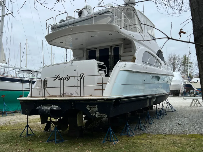 Slide: The Image of 2008 Hatteras 64 Motor Yacht dry docked outdoors. - 34