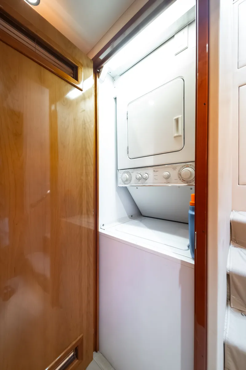 Slide: The Image of Washer and dryer in a wooden cabinet on a yacht. - 23