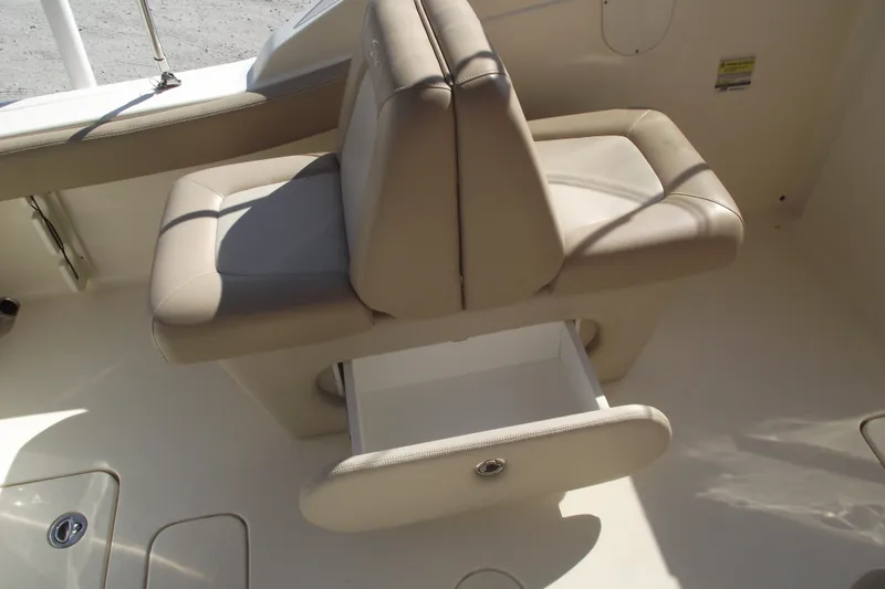 Slide: The Image of 2022 Scout 215 Dorado boat seat with storage drawer open. - 20
