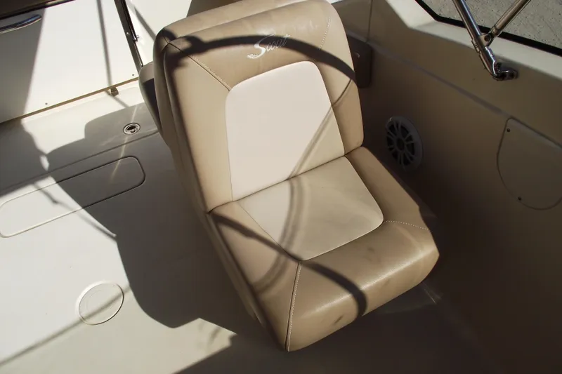 Slide: The Image of 2022 Scout 215 Dorado boat seat, beige upholstery, interior view. - 21