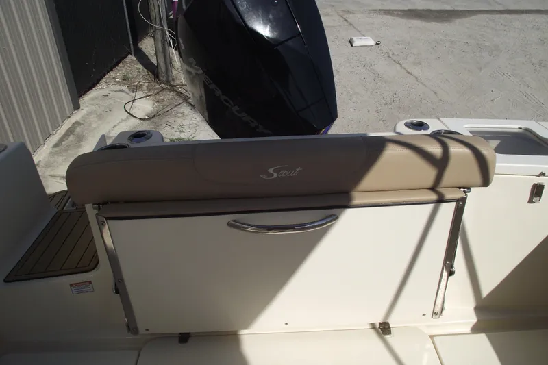 Slide: The Image of 2022 Scout 215 Dorado boat interior with seating and Mercury engine. - 29
