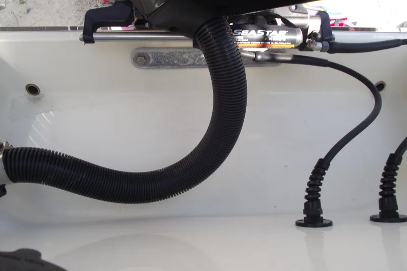 Slide: The Image of Close-up of 2022 Scout 215 Dorado boat's steering and hydraulic system components. - 35