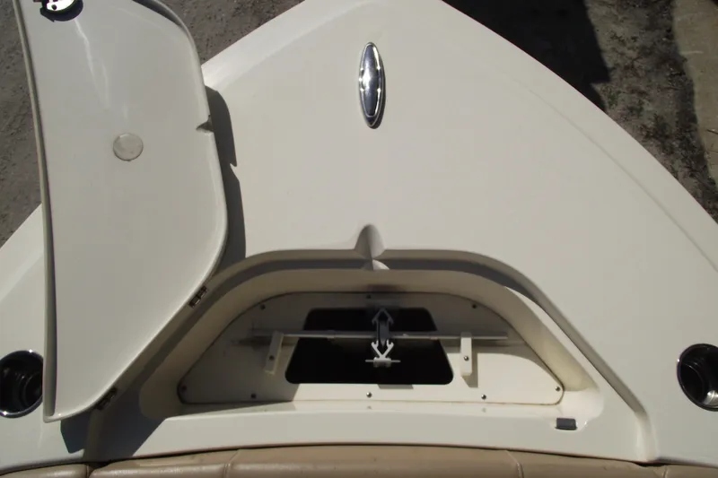 Slide: The Image of 2022 Scout 215 Dorado boat anchor compartment with open hatch. - 7