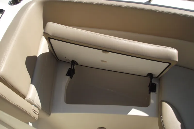 Slide: The Image of 2022 Scout 215 Dorado boat seat storage compartment, open and empty. - 8