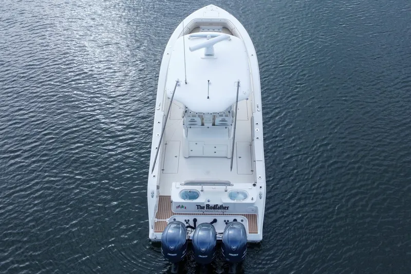 Slide: The Image of 2015 Cobia 344 Center Console boat on water, aerial view. - 19