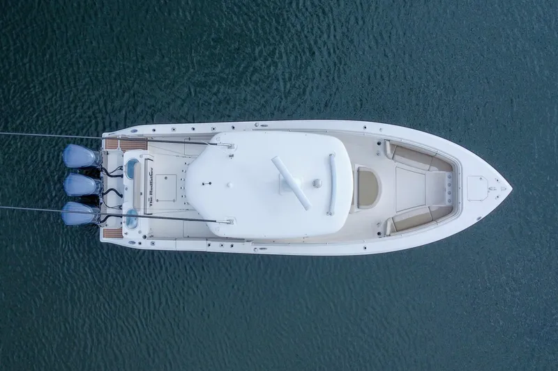 Slide: The Image of Overhead view of 2015 Cobia 344 Center Console boat on water. - 20
