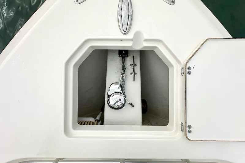 Slide: The Image of Anchor compartment of 2015 Cobia 344 Center Console boat, open hatch view. - 43
