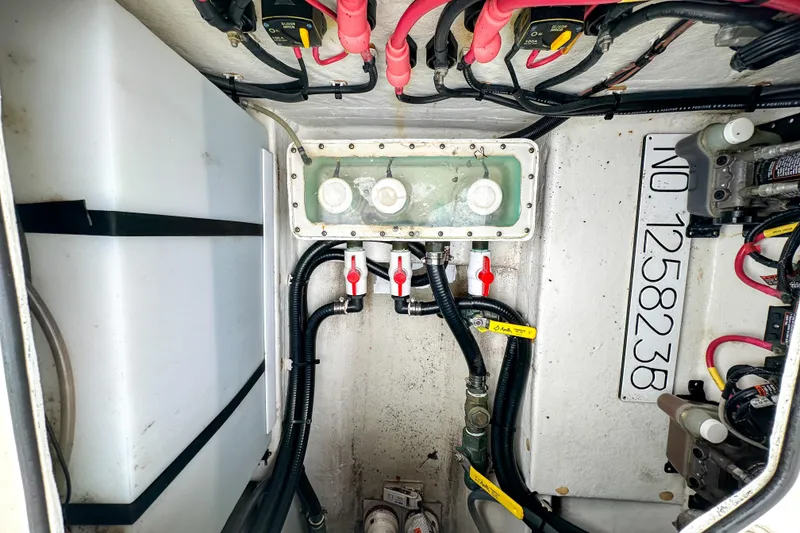 Slide: The Image of 2015 Cobia 344 Center Console boat wiring and plumbing system close-up. - 49