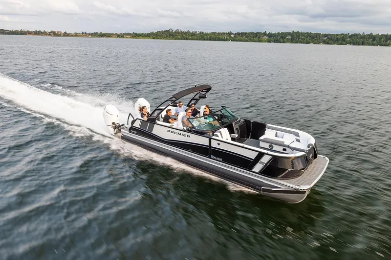 Slide: The Image of 2026 Premier 270 Super Sport boat cruising on a lake with passengers onboard. - 7