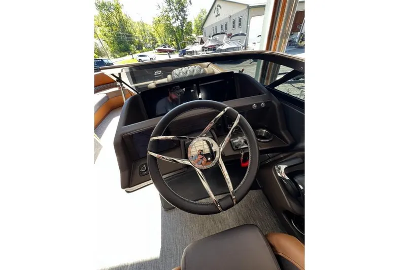Slide: The Image of Steering wheel of a 2026 Bennington Swingback 25 boat, showcasing modern design. - 8
