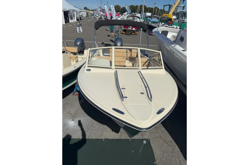 The Image of 2026 Rossiter 20 Day Boat displayed at a boat show, featuring sleek design and modern amenities. - 1