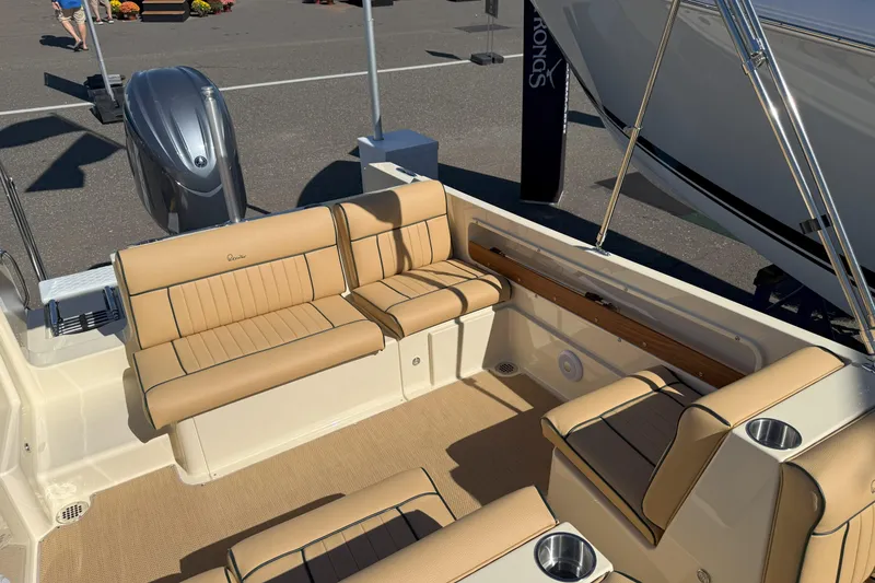 Slide: The Image of 2026 Rossiter 20 Day Boat interior with tan seating and modern design. - 11