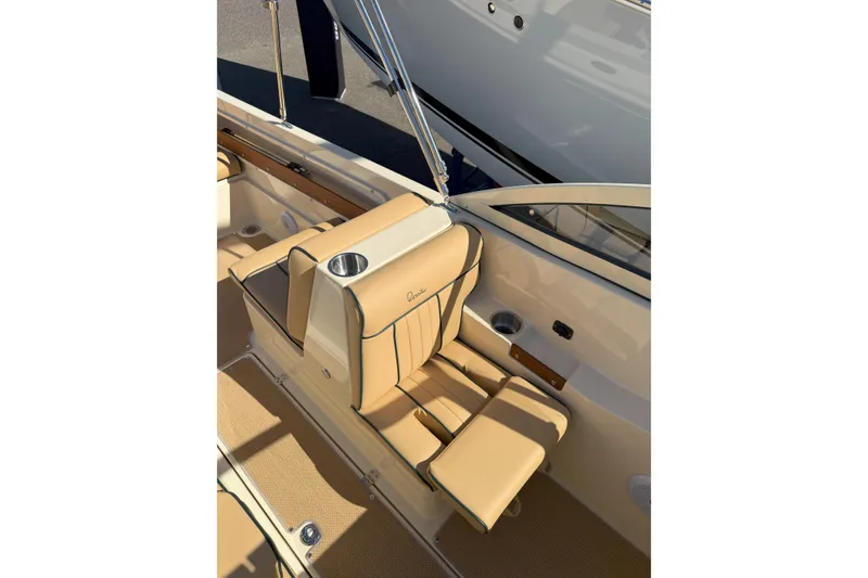 Slide: The Image of 2026 Rossiter 20 Day Boat interior with tan seating and cup holder. - 13
