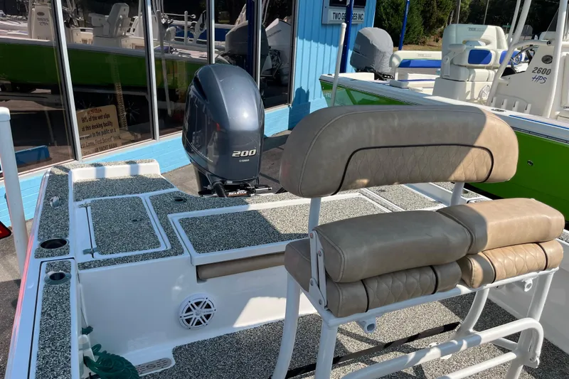 Slide: The Image of 2019 Sportsman Masters 227 Bay Boat with Yamaha 200 engine, beige seating, and fishing deck. - 13