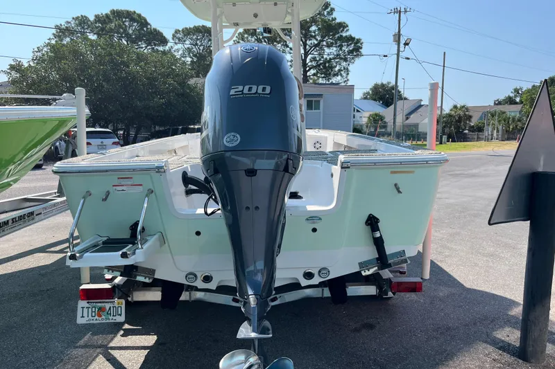 Slide: The Image of 2019 Sportsman Masters 227 Bay Boat with Yamaha 200 engine, parked outdoors. - 4
