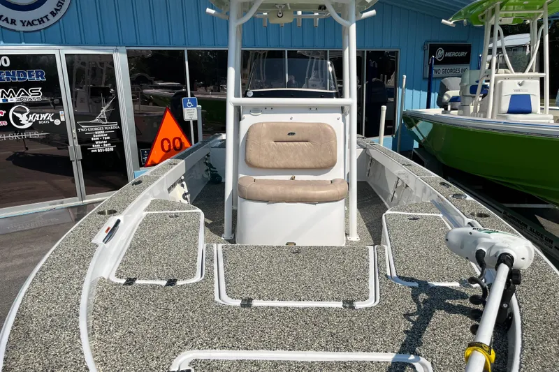 Slide: The Image of 2019 Sportsman Masters 227 Bay Boat with seating and fishing deck, displayed at marina. - 7