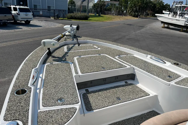 Slide: The Image of 2019 Sportsman Masters 227 Bay Boat with textured deck and trolling motor. - 8