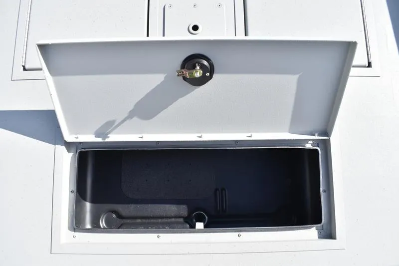 Slide: The Image of Open storage compartment on 2025 Lowe Roughneck RX1860 CC boat. - 15