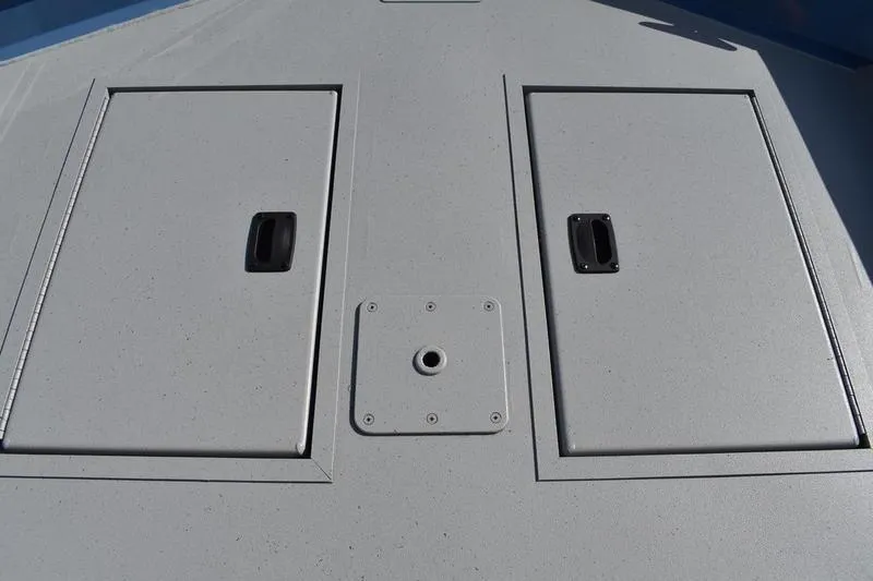 Slide: The Image of 2025 Lowe Roughneck RX1860 CC boat deck with storage compartments and mounting point. - 17