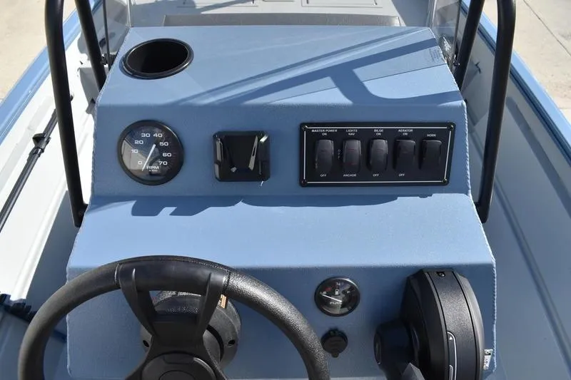 Slide: The Image of 2025 Lowe Roughneck RX1860 CC boat console with steering wheel and control panel. - 19