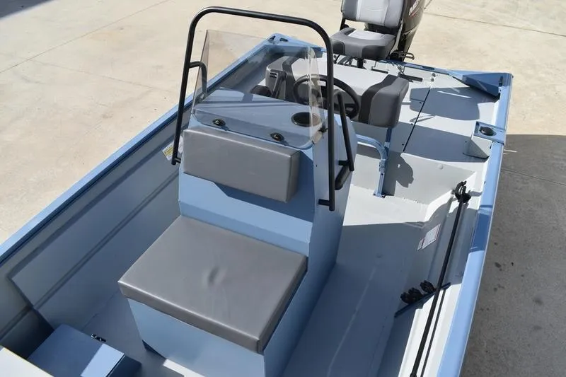 Slide: The Image of 2025 Lowe Roughneck RX1860 CC boat interior with seating and steering console. - 21