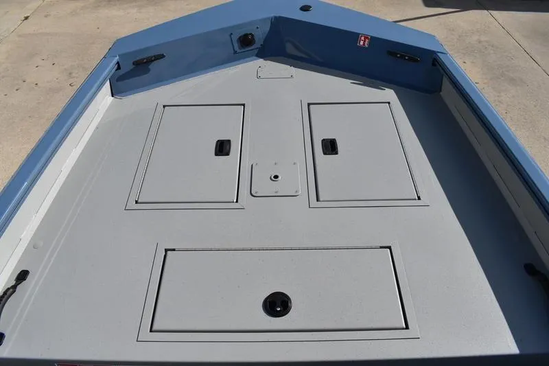 Slide: The Image of 2025 Lowe Roughneck RX1860 CC boat deck with storage compartments. - 6