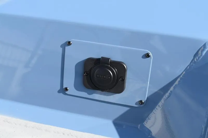 Slide: The Image of 2025 Lowe Roughneck RX1860 CC boat detail with a mounted electrical outlet. - 7