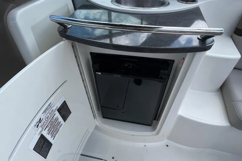 Slide: The Image of 2011 Sea Ray 270 SLX boat interior with mini fridge and sink. - 7