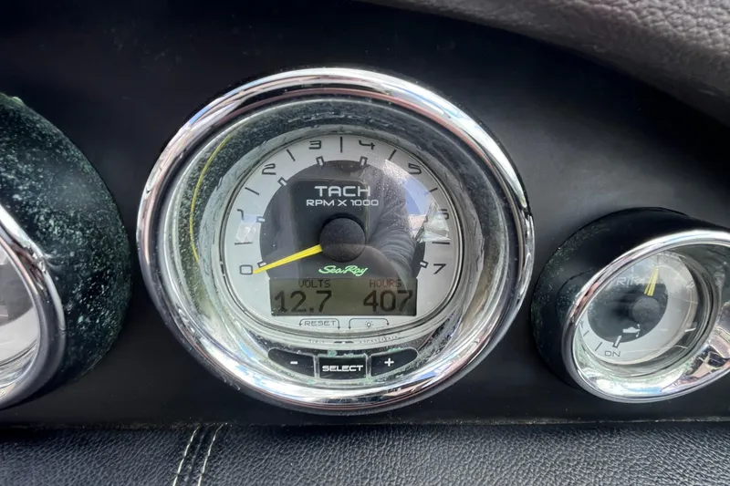 Slide: The Image of Tachometer of 2011 Sea Ray 270 SLX showing 12.7 volts and 407 hours. - 9