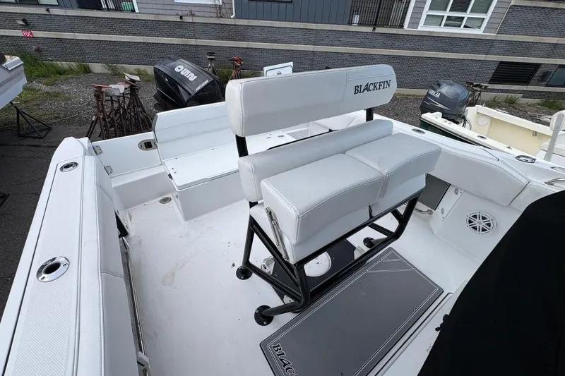 Slide: The Image of 2020 Blackfin 212 CC boat interior with white seating and modern design. - 11