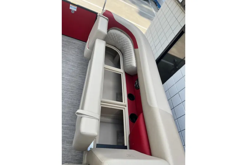 Slide: The Image of 2026 Godfrey SWEETWATER 2286 SB boat interior with red and beige seating. - 12