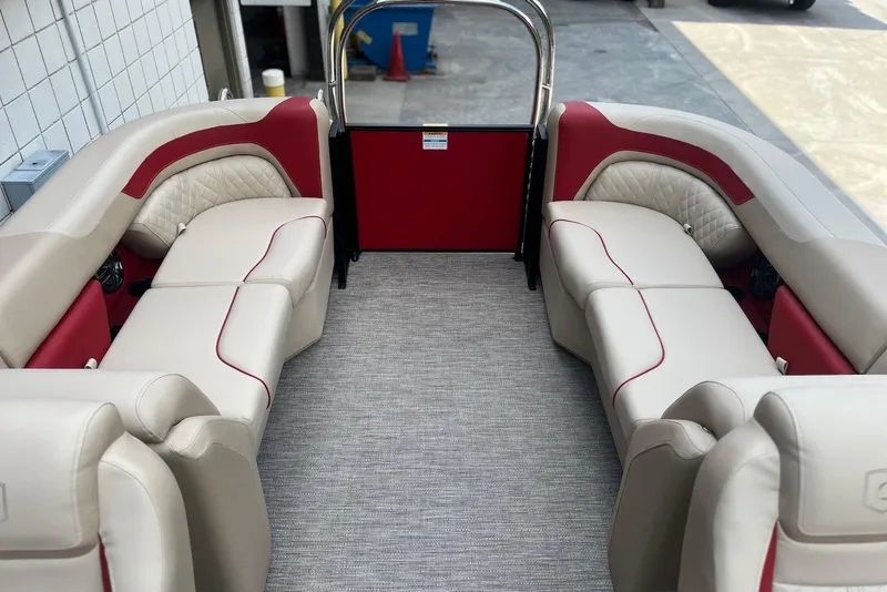 Slide: The Image of 2026 Godfrey SWEETWATER 2286 SB boat interior with beige and red seating. - 20