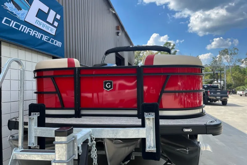 Slide: The Image of 2026 Godfrey SWEETWATER 2286 SB pontoon boat, red exterior, parked outdoors. - 5