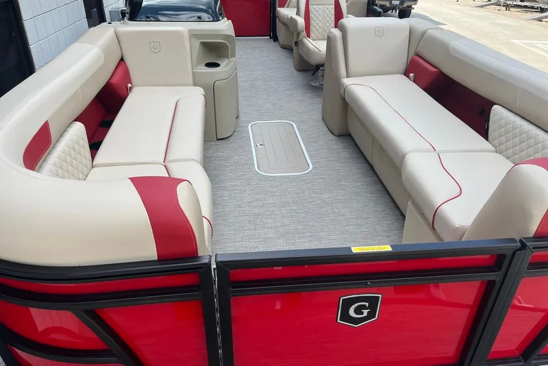 Slide: The Image of 2026 Godfrey SWEETWATER 2286 SB pontoon boat interior with beige and red seating. - 7