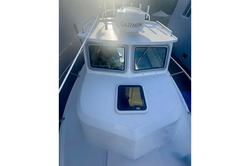 Slide: The Image of 2024 Parker 2320 Sport Cabin boat with Garmin equipment, top view. - 12