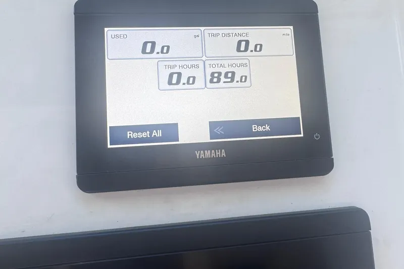 Slide: The Image of Yamaha display on 2024 Parker 2320 Sport Cabin showing trip and total hours. - 20