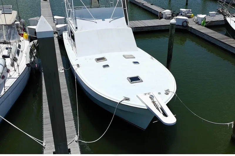 The Image of 1978 Marine Management 48 Sport Fish boat docked in marina, aerial view. - 1