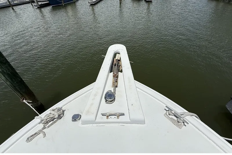 Slide: The Image of Bow of 1978 Marine Management 48 Sport Fish boat docked at marina. - 12