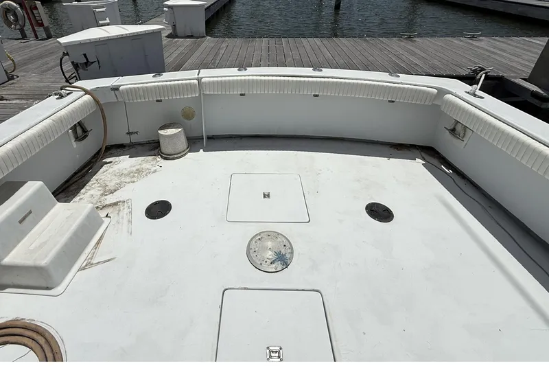 Slide: The Image of 1978 Marine Management 48 Sport Fish boat deck, docked at marina. - 15