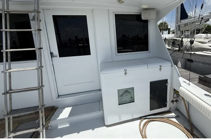 Slide: The Image of 1978 Marine Management 48 Sport Fish boat deck with ladder and storage, Galveston, Texas. - 17