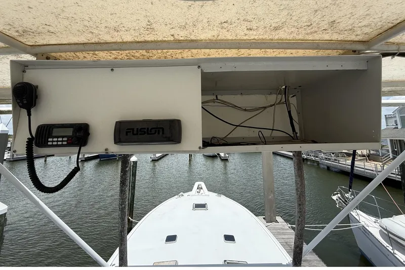 Slide: The Image of 1978 Marine Management 48 Sport Fish boat with radio equipment and open storage compartment. - 22