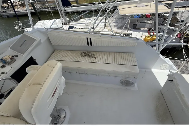 Slide: The Image of 1978 Marine Management 48 Sport Fish boat interior with seating and navigation equipment. - 25